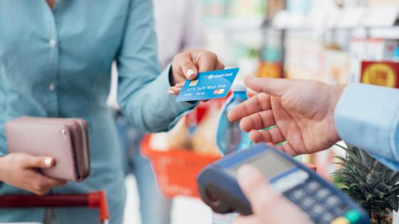 Woman making purchase with credit card
